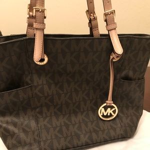 Brown Michael Kors tote with beige handles